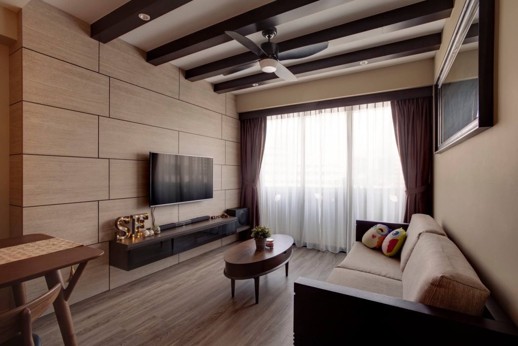 Resort-style living room with wooden ceiling beams