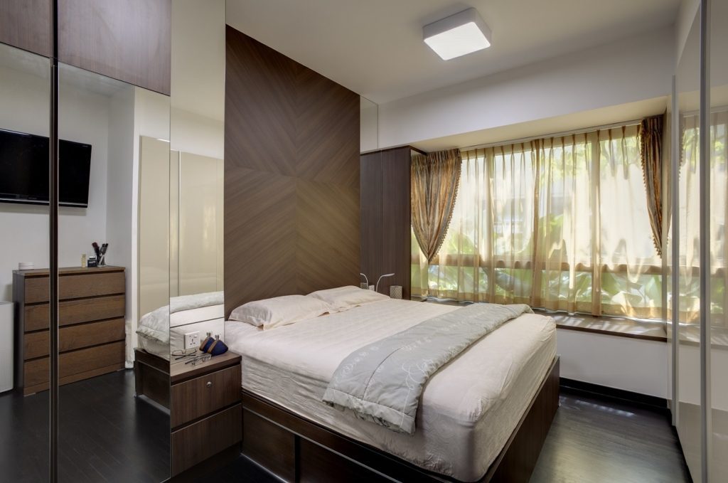 Luxury bedroom with large mirrors and sheer curtains