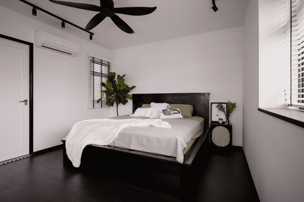 Black and white bedroom with indoor plants