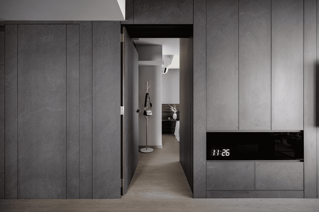 Concealed grey door opened in the wall