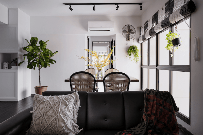 Black and white dining area with visible plants